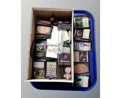 A collection of Magic: The Gathering trading cards, dice etc.