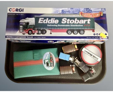 A tray containing Corgi Eddie Stobart Scania R Curtainside trailer, further die cast vehicles, a set of Eddie Stobart coaster