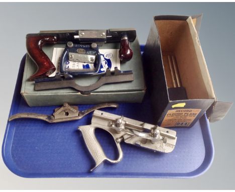 A vintage Record combined hard and soft board plane no. 735 in box, together with a Record rough plane and further planes.