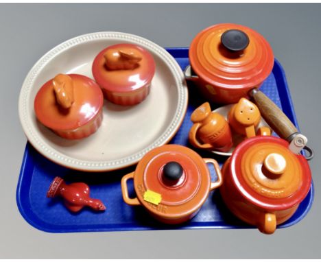 A tray containing a Le Creuset cast iron lidded pan, ceramic pots, two Bella Cuisina dishes, cast ironware etc.