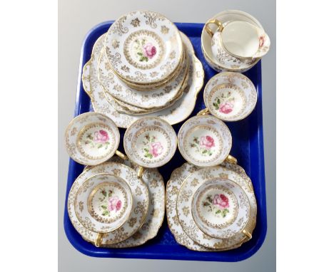 A tray containing a Wedgwood bone china hand finished rose spray tea service.