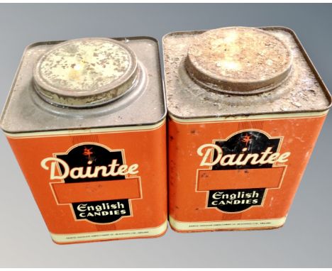 A vintage pair of English metal tins with Daintee advertisement decoration.
