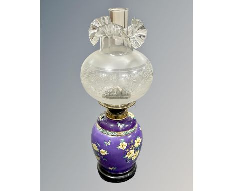 A scarce Maling Cetem Ware oil lamp with glass shade and chimney, circa 1910, on purple ground with floral hand-painted decor