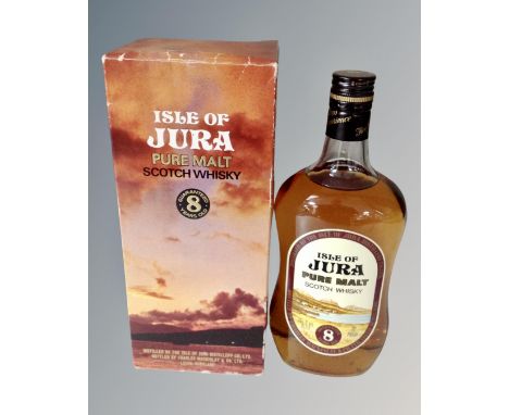 A bottle of Isle of Jura pure malt scotch whisky, eight years old, in box.