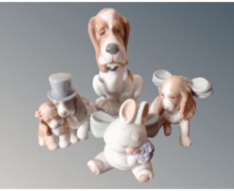 Four Nao figures, three dogs and a rabbit.