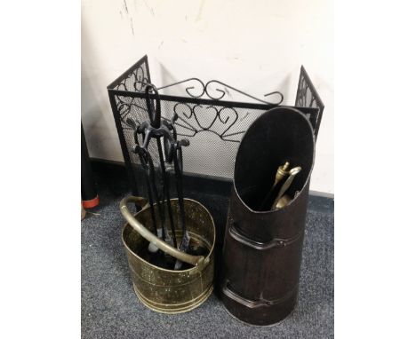 A folding metal spark guard together with four piece cast companion set on stand, brass coal bucket and helmet, brass chestnu