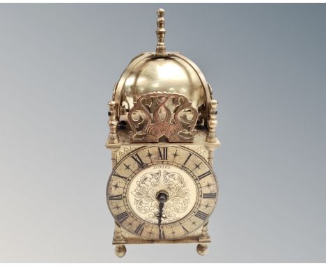 A reproduction brass lantern clock. (height 23cm)