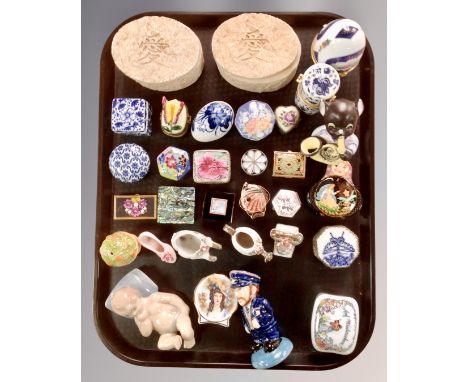 A tray of miniature pillboxes, a ceramic figure of a child, continental figures etc.