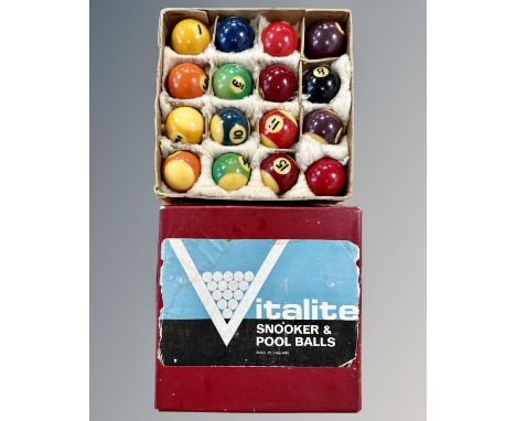 A vintage box of Italite pool balls, size 1¾", together with a table top football game. (2)