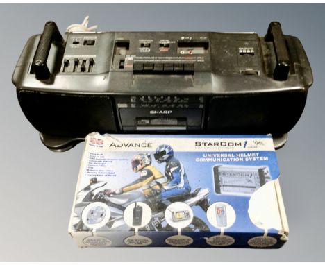 A retro Sharp portable hifi together with a Starcom universal helmet communication system.
