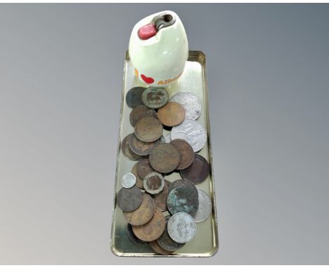 A collection of coins including a commemorative crown together with a vintage table lighter.