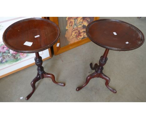 A pair of dark oak occasional tripod tables (2) 
