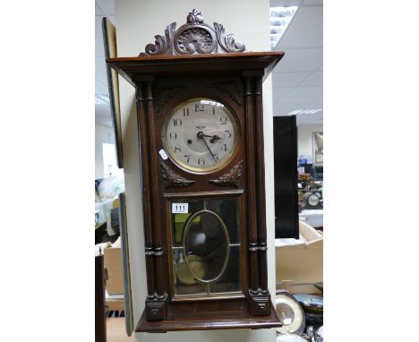 Mid-century oak cased wall cloak with bevel edged dial and glazed front 