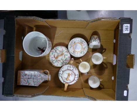 A collection of unmarked ironstone items decorated in oriental bamboo decoration to include biscuit barrel, teapot, decanter,