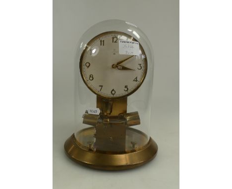 Junghans 1000 day clock under glass dome on brass base together with paperwork (needs battery)