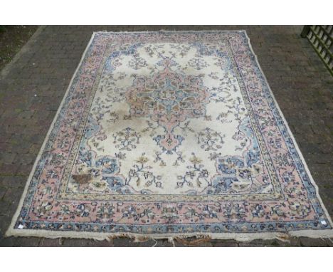 Large handmade Indian Carpet in cream, blue and red (11cm rip to corner)