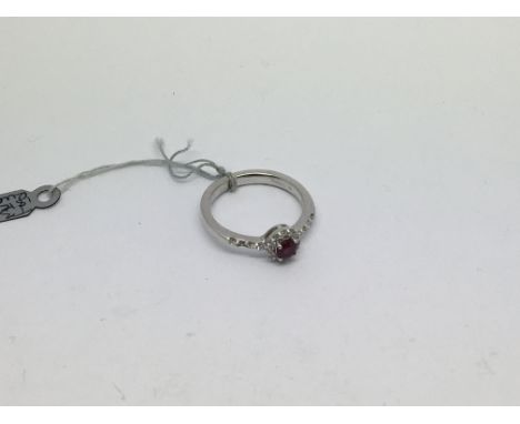 An 18ct white gold ring set with a ruby and diamonds approx 0.33g. Size m/n approx weight 4g
