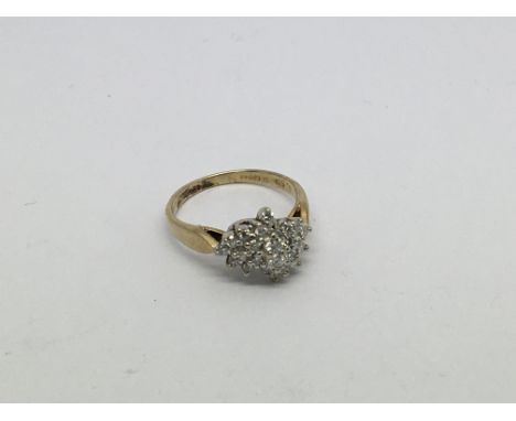A 9ct gold ring set with a 23 diamond cluster approx 0.5ct. Size l approx weight 2.8g