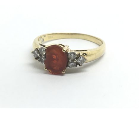 An 18ct yellow gold ring set with fire opal and six diamonds, approx 0.25ct, weight approx 3g, ring size approx P/Q