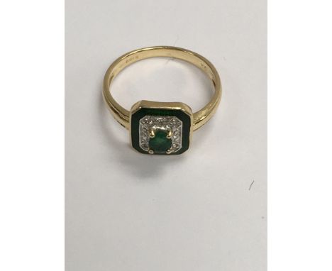 A 14 ct emerald and diamond ring of Art Deco style size N .