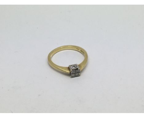 An 18ct gold ring set with 4 princess cut diamonds approx 0.25ct. Size o/p approx weight 3.6g