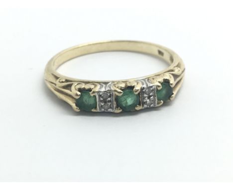 A 9ct yellow gold ring set with emeralds and diamonds, weight approx 2.1g, ring size approx P