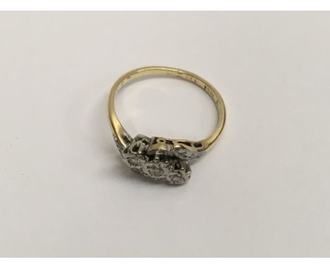 An 18ct gold and 3 stone diamond ring (I).