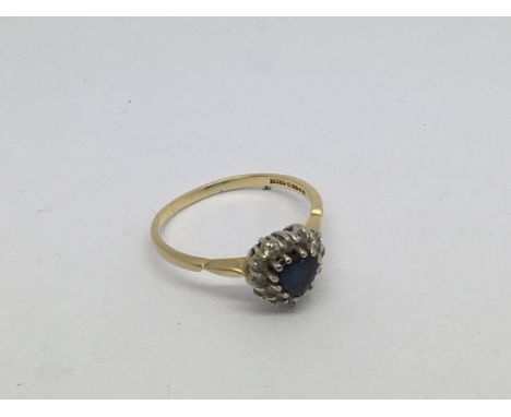 An 18ct gold ring set with heart shaped sapphire and diamond cluster. Size r approx weight 3.2g