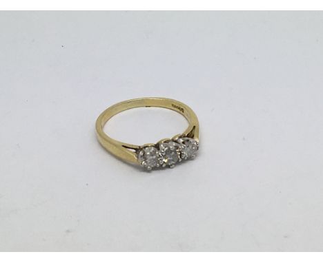 An 18ct gold ring set with 3 diamonds approx 0.5ct. Size l approx weight 2.5g