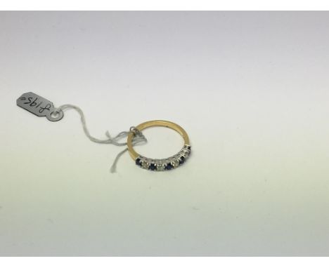 An 18ct gold half eternity ring set with sapphire and diamond. Size m approx weight 2.2g
