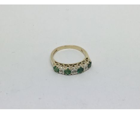 A 9ct gold ring set with 4 emeralds and 4 diamonds approx 0.5ct. Size l/m approx weight 2.5g