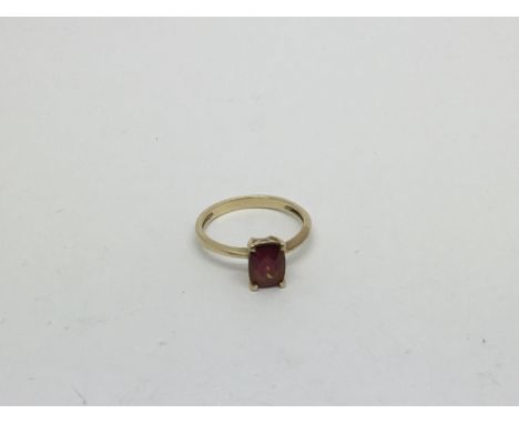 A 9ct gold ring set with a faceted Ruby. Size n approx weight 1.8g