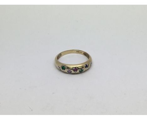 A 9ct gold ring set with multi stones. Size q/r approx weight 2.2g