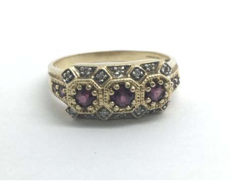 A 9ct yellow gold ring set with rubies and diamonds, weight approx 6.3g, ring size approx R/S