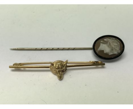 A Silver gilt fox head brooch plus a cameo stick pin.