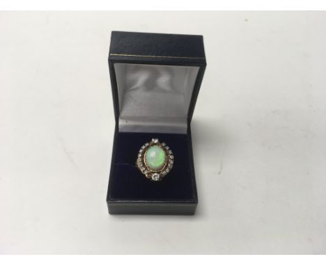 A ladies 14k gold opal and diamond ring, approx weight 8.7g, approx size P-Q