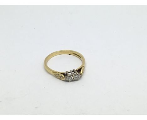 An 18ct gold ring set with 2 diamonds approx 0.30ct. Size l/m approx weight 2.4g