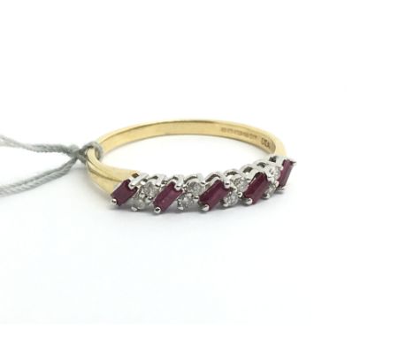 An 18ct yellow gold ring set with a row of alternating baguette cut rubies and diamonds, weight approx 2.8g, ring size approx