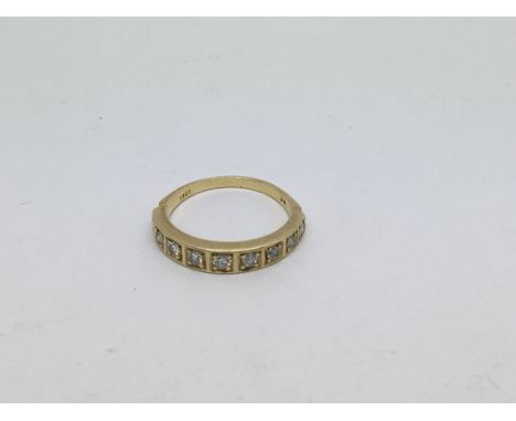 An 18ct gold Half eternity ring set with 9 diamonds approx 0.36ct. Size p approx weight 3.8g