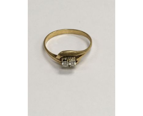 A 18 ct gold ring inset with two small diamonds. Size O