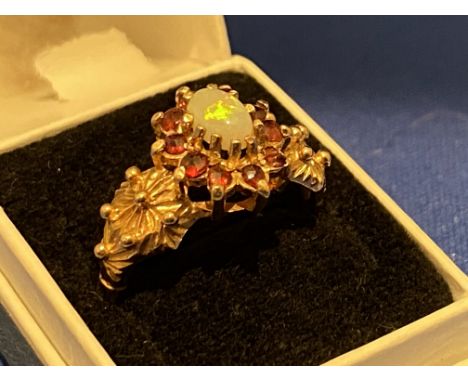 A 9ct gold opal and garnet ring, 3.3g.