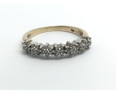 A 9ct yellow gold ring set with a row of seven rose clusters of diamonds, approx 0.40ct, weight approx 2.5g, ring size approx