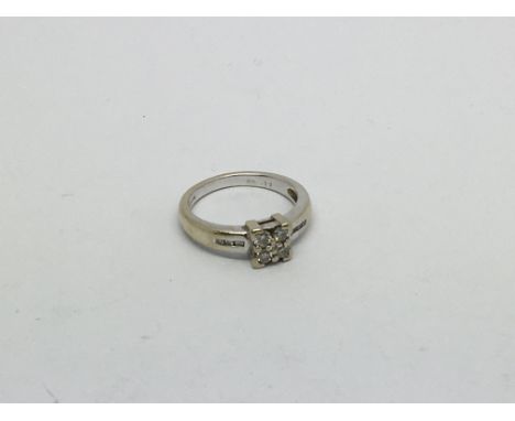 An 18ct white gold ring set with 5 diamonds approx 0.20ct. Size k/l approx weight 4.5g