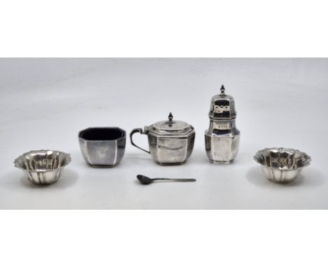 A three piece octagonal form silver cruet set, by William Neale &amp; Son Ltd, Birmingham 1930, comprising lidded mustard wit