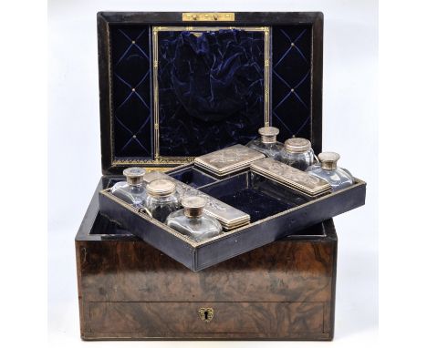 A Victorian burr walnut and ebony ladies' travelling vanity case,&nbsp;the fitted interior with lift-out tray containing a nu