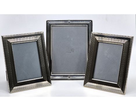A pair of Christofle silver plated easel back rectangular photograph frames,&nbsp;19.5cm x 15.5cm, together with another Chri