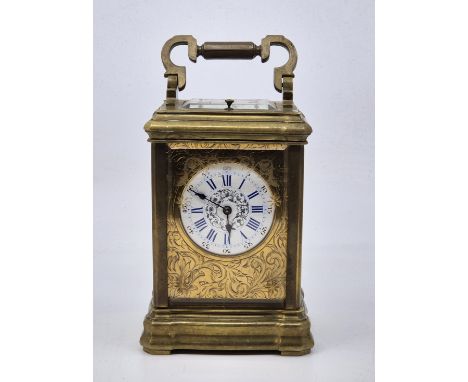 A late 19th century French 8-day repeating brass carriage clock, gong strike, having white enamel Roman numeral dial with Ara