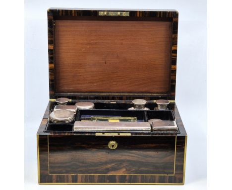 A Victorian brass bound and inlaid coromandel ladies' travelling vanity case, with campaign style handles, the fitted interio