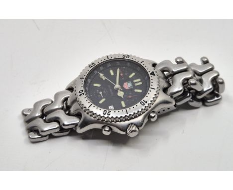 A Tag Heuer unisex stainless steel quartz chronograph bracelet watch, ref.S39.306M, having signed black circular dial with ap