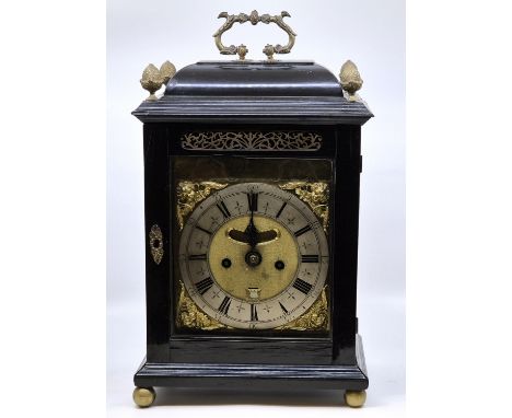 An early 18th century ebonised W. Tomlinson (London) bracket clock, having 6 1/2inch silvered Roman numeral chapter ring with